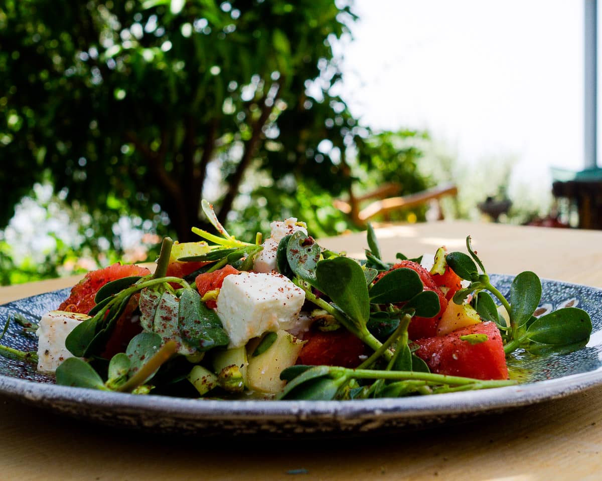 Watermelon and Feta Salad with a Minty Lime Dressing on a ceramic plate