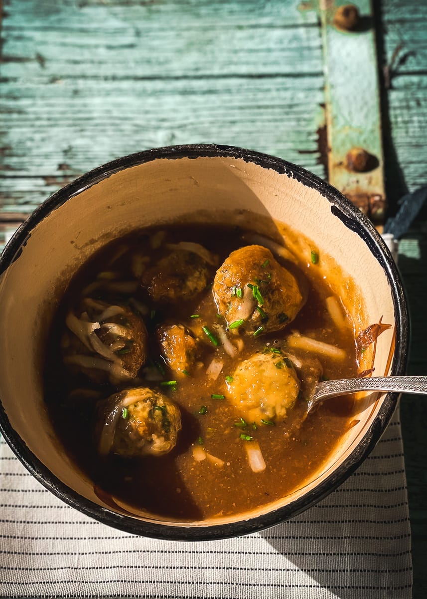 Celeriac soup with chicken dumplings and grated parmesan.