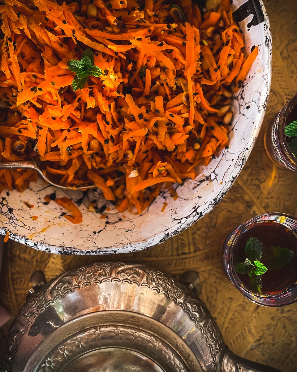 Moroccan table setting with raw carrot salad.