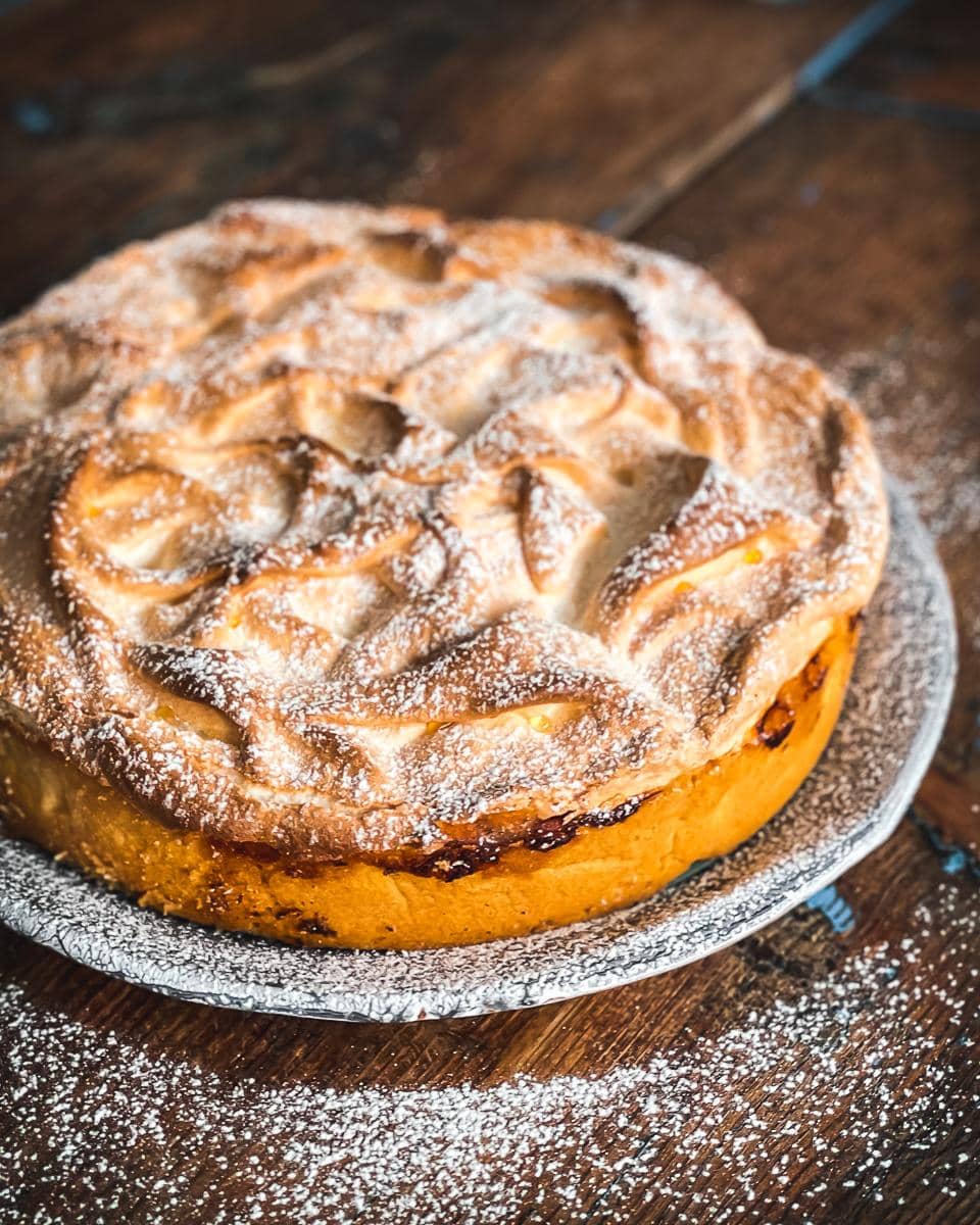 Lemon Meringue Pie with golden meringue dusted with sugar.