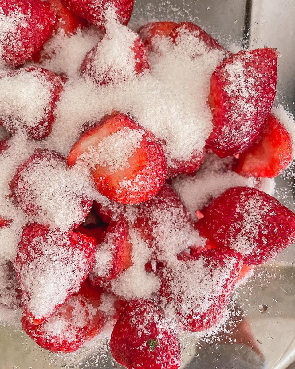 Preparing fresh strawberries for strawberry jam