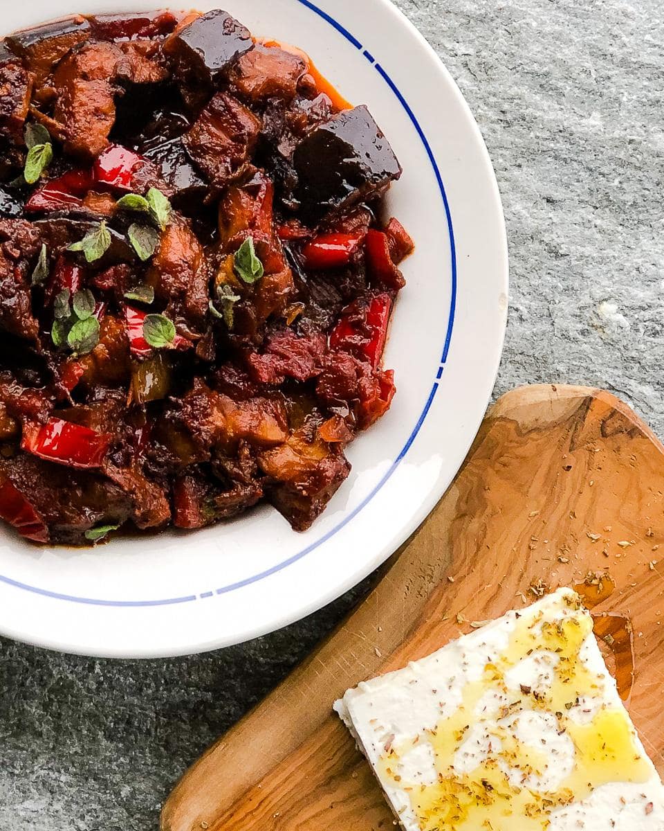 Pelion Spetsofai with aubergine, peppers and local sausage. Served with a slice of Feta.