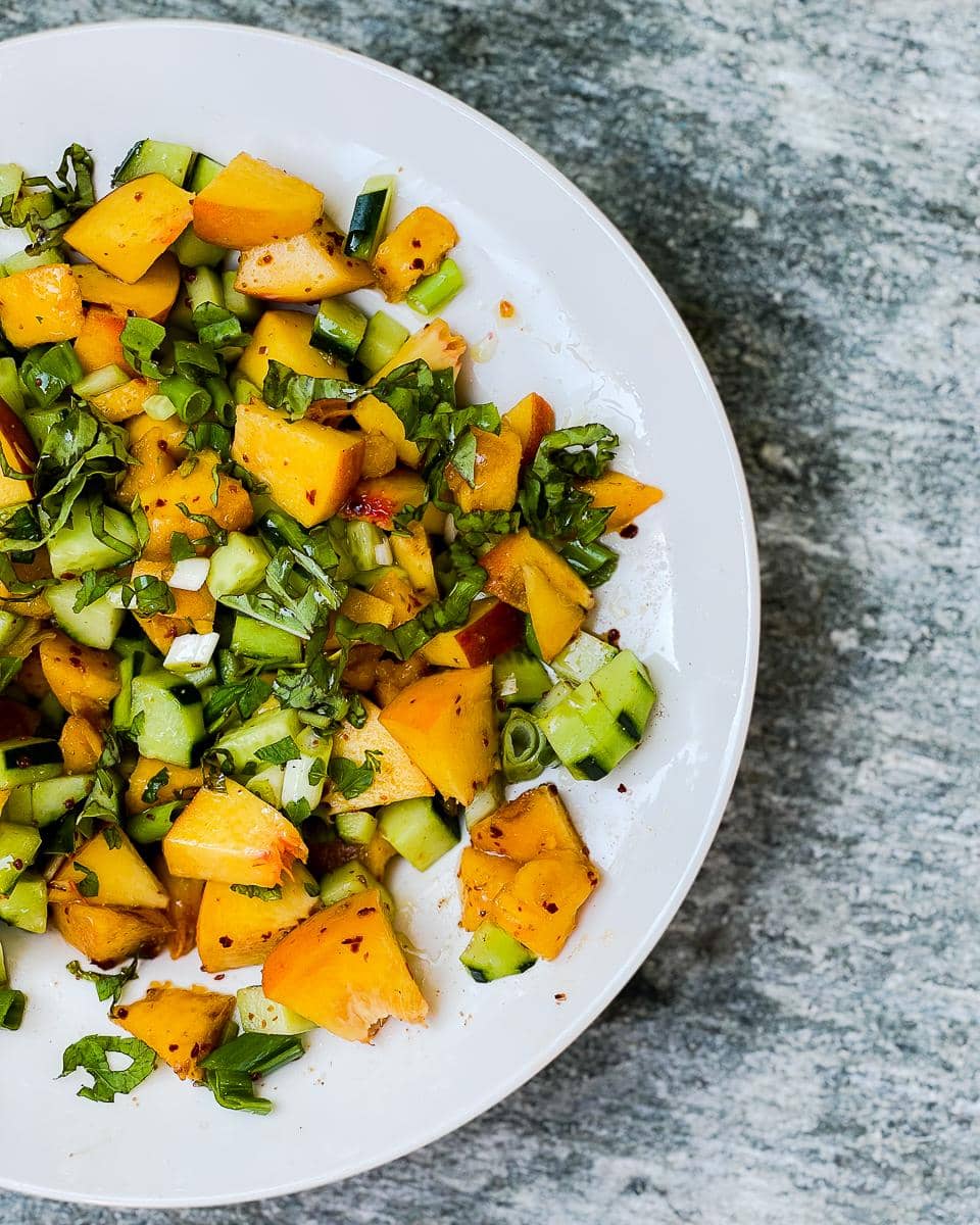 A twist on kachumber, replacing tomatoes with peaches.