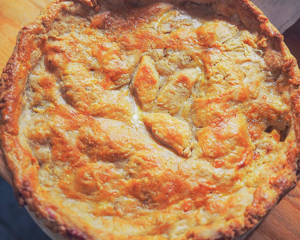 A finished Chicken Pie with Parmesan Crust looks ready to be served. 