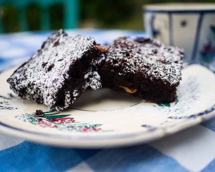 Fudgy Chocolate Brownie with Walnuts are coated in some powdery sugar