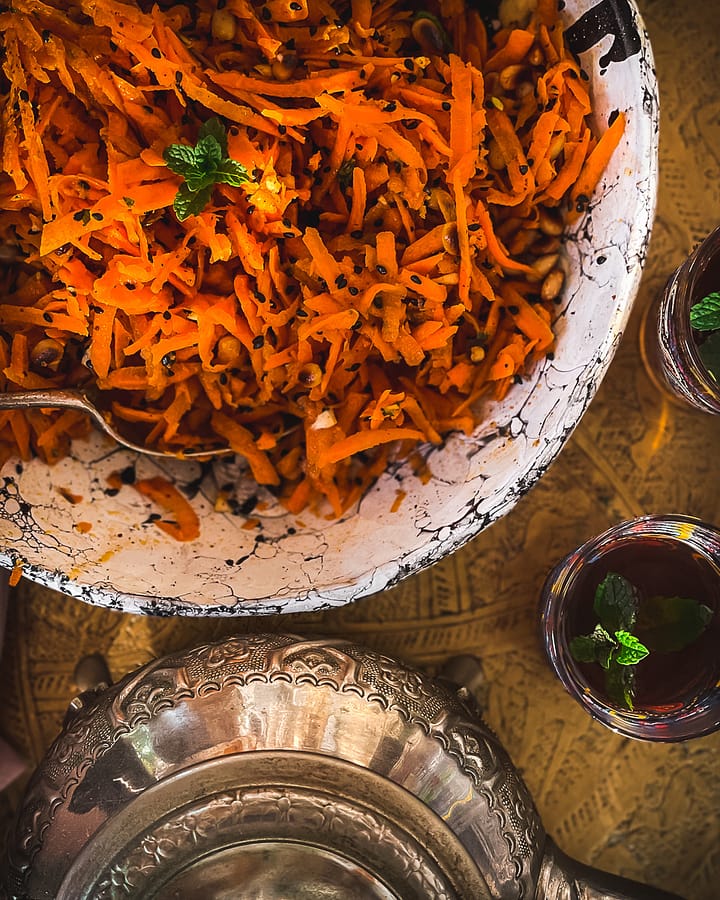 Moroccan table setting with raw carrot salad.