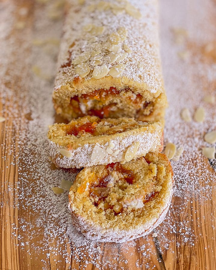 Apricot roulade with cinnamon apricot jam, vanilla cream and flaked almonds.