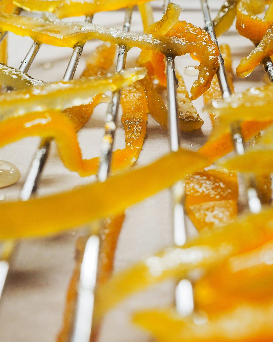 Homemade mixed candied peel on a drying rack 
